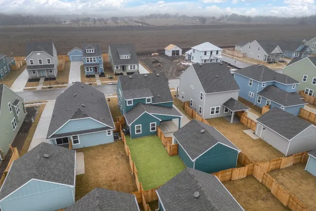 a view of a backyard of the house