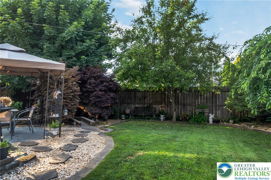 365 Rock Street Easton, PA 18042 - Photo 42 of 50 Lush landscaping and a private fenced yard provide an ideal outdoor retreat.