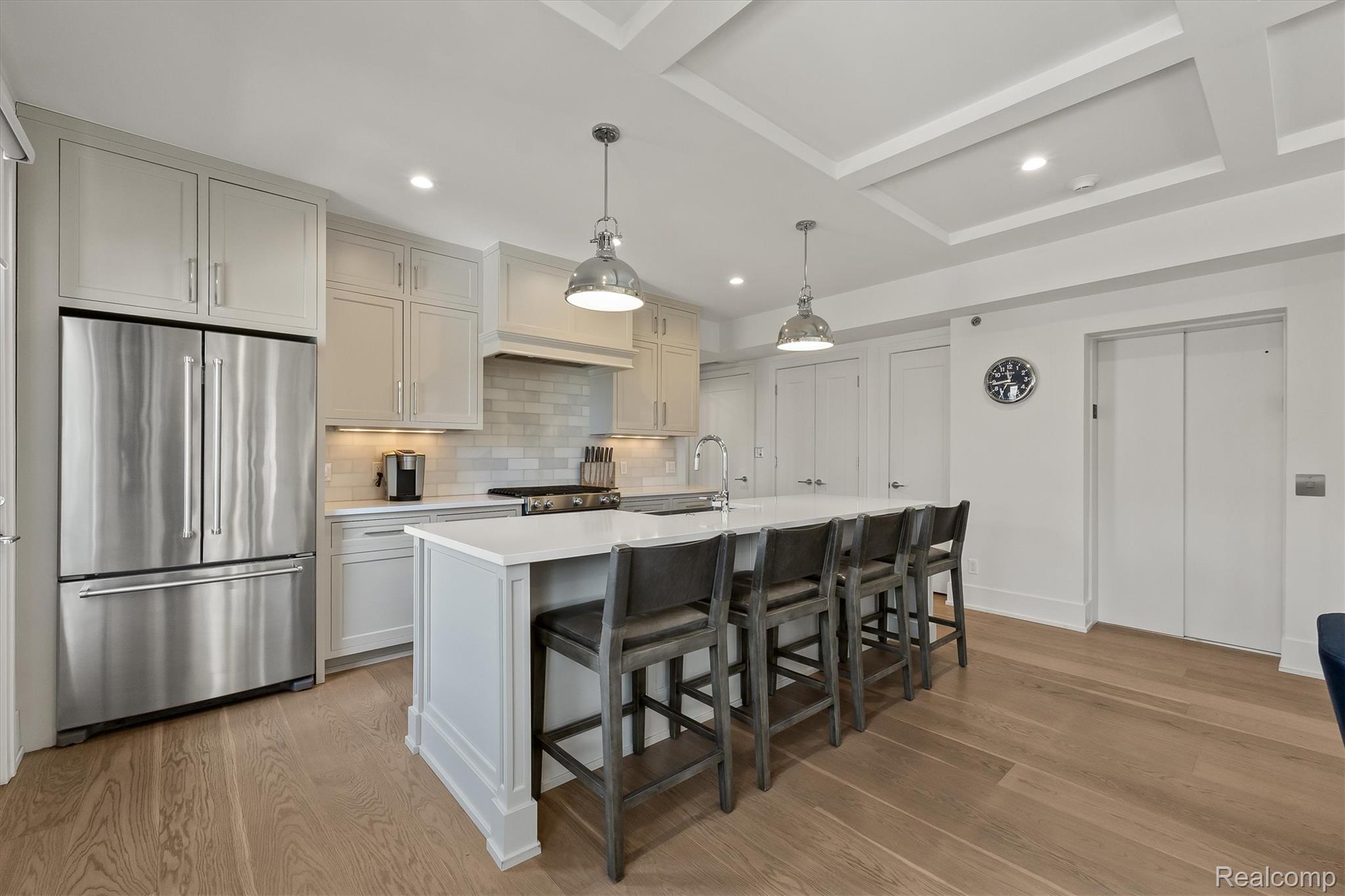936 West Eleven Mile Road Royal Oak, MI 48067 - Photo 5 of 19 Kitchen with stainless steel appliances, pendant lighting, elevator, and light wood-style floors