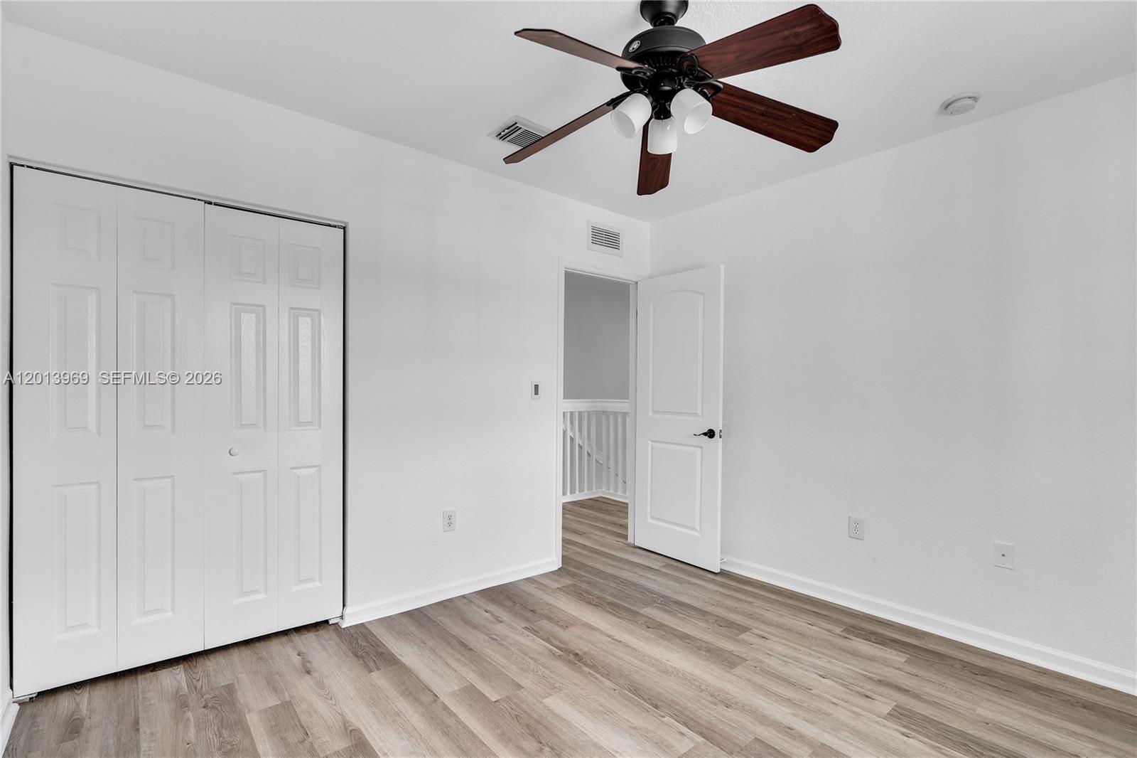14044 Southwest 273rd Lane, Unit 14044 Homestead, FL 33032 - Photo 28 of 44 wooden floor in an empty room