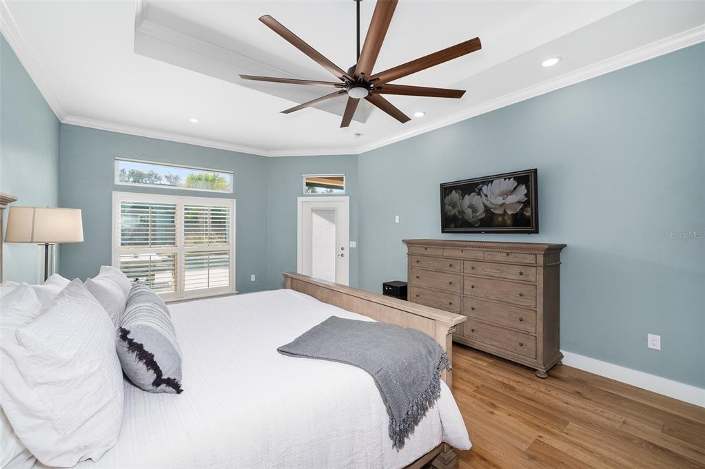 13549 Northwest 9 Road Newberry, FL 32669 - Photo 18 of 42 a bedroom with a bed and a flat screen tv