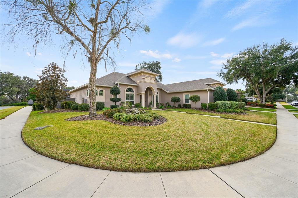 13549 Northwest 9 Road Newberry, FL 32669 - Photo 2 of 42 a view of a white house with a swimming pool