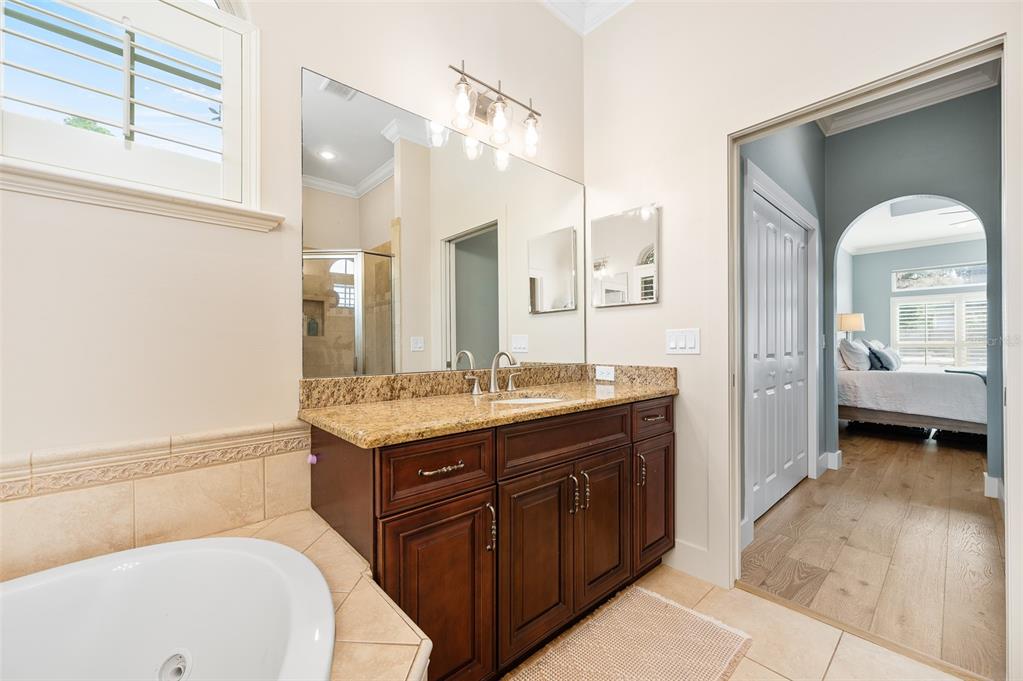 13549 Northwest 9 Road Newberry, FL 32669 - Photo 24 of 42 a bathroom with a sink and a mirror