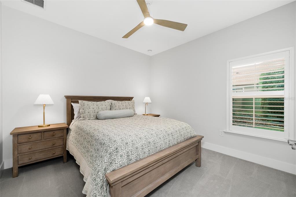 13549 Northwest 9 Road Newberry, FL 32669 - Photo 28 of 42 a bedroom with a bed a dresser and a window