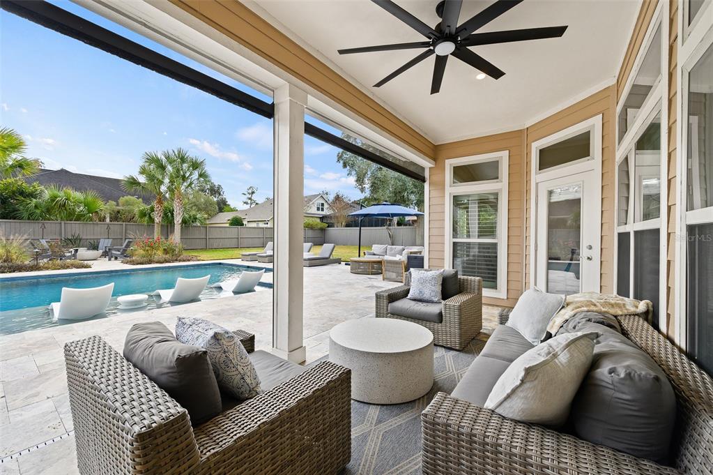 13549 Northwest 9 Road Newberry, FL 32669 - Photo 32 of 42 a living room with furniture and a floor to ceiling window