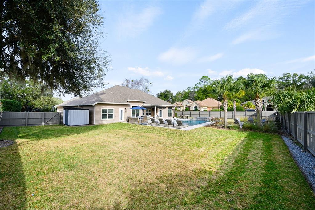 13549 Northwest 9 Road Newberry, FL 32669 - Photo 40 of 42 a front view of a house with garden