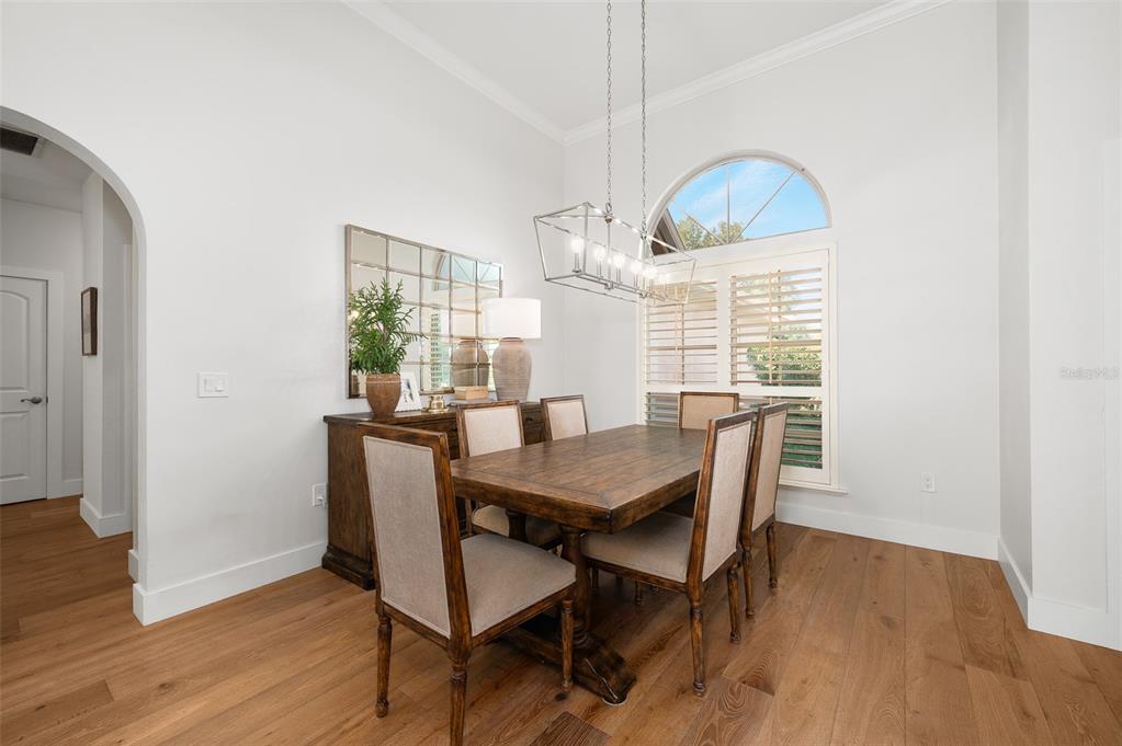 13549 Northwest 9 Road Newberry, FL 32669 - Photo 4 of 42 a view of a dining room with furniture window and wooden floor