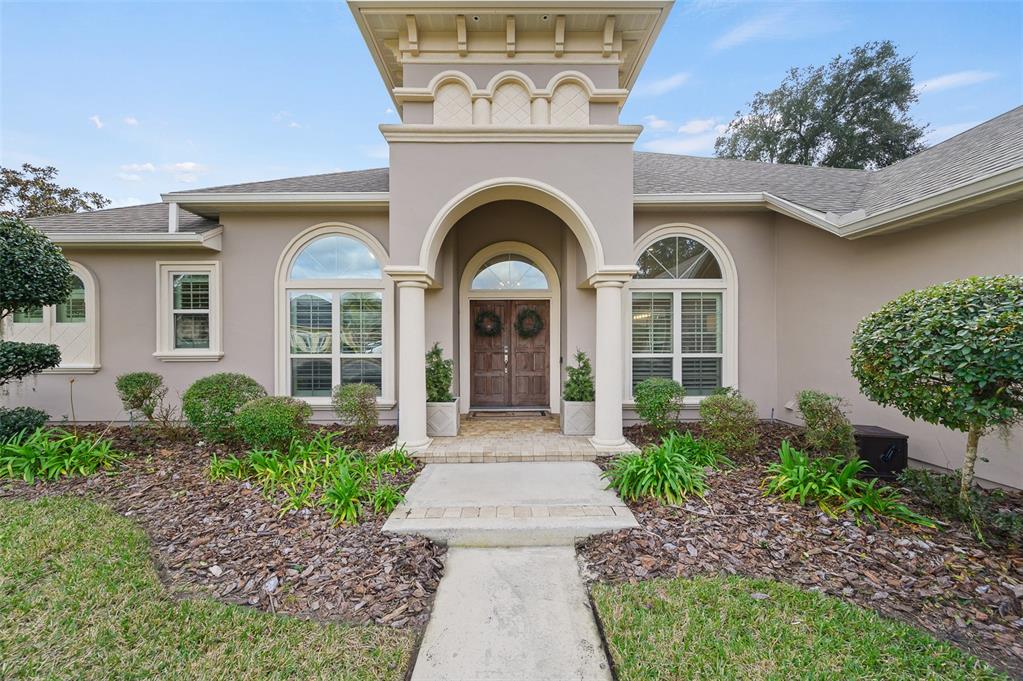 13549 Northwest 9 Road Newberry, FL 32669 - Photo 42 of 42 a front view of a house with garden