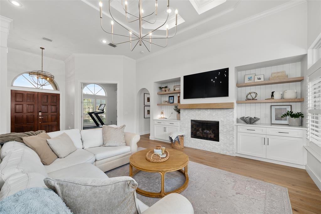 13549 Northwest 9 Road Newberry, FL 32669 - Photo 5 of 42 a living room with furniture a fireplace and a flat screen tv
