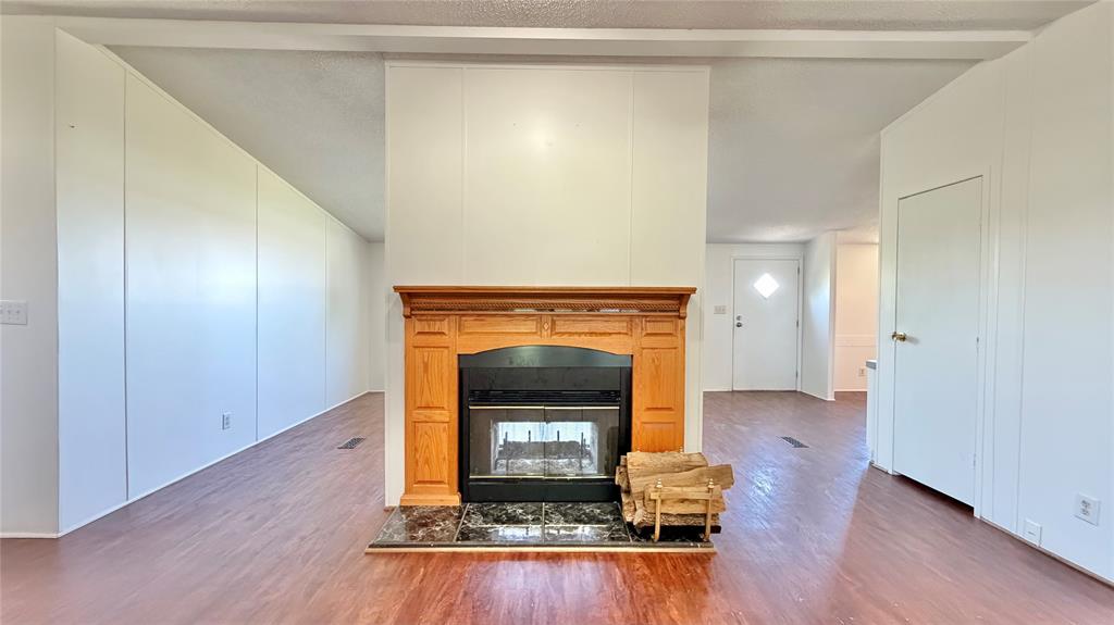 3789 Jacobs Lane Kaufman, TX 75142 - Photo 4 of 33 a living room with a fireplace