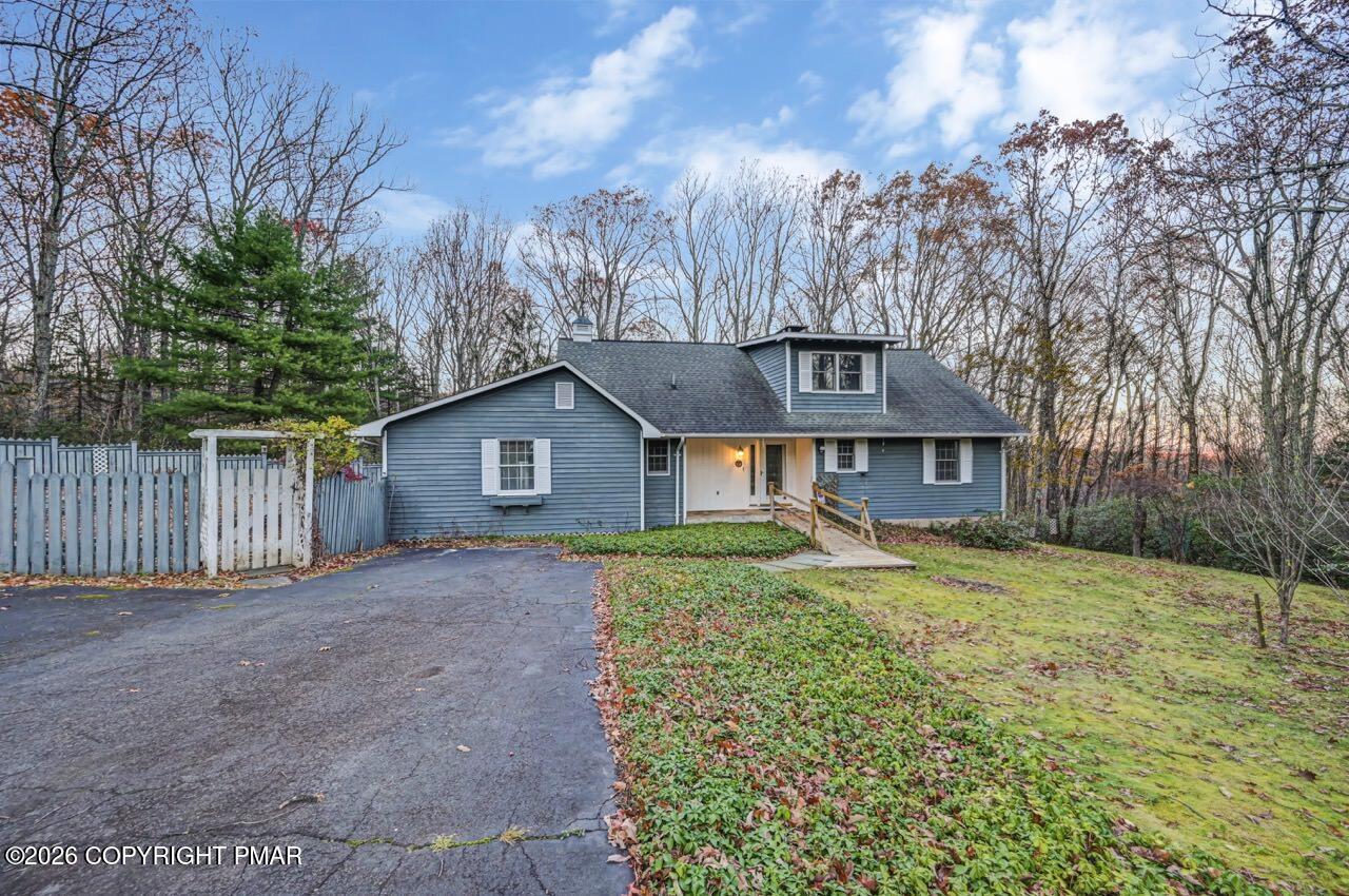 384 Devils Hole Road Cresco, PA 18326 - Photo 92 of 97 a front view of a house with yard