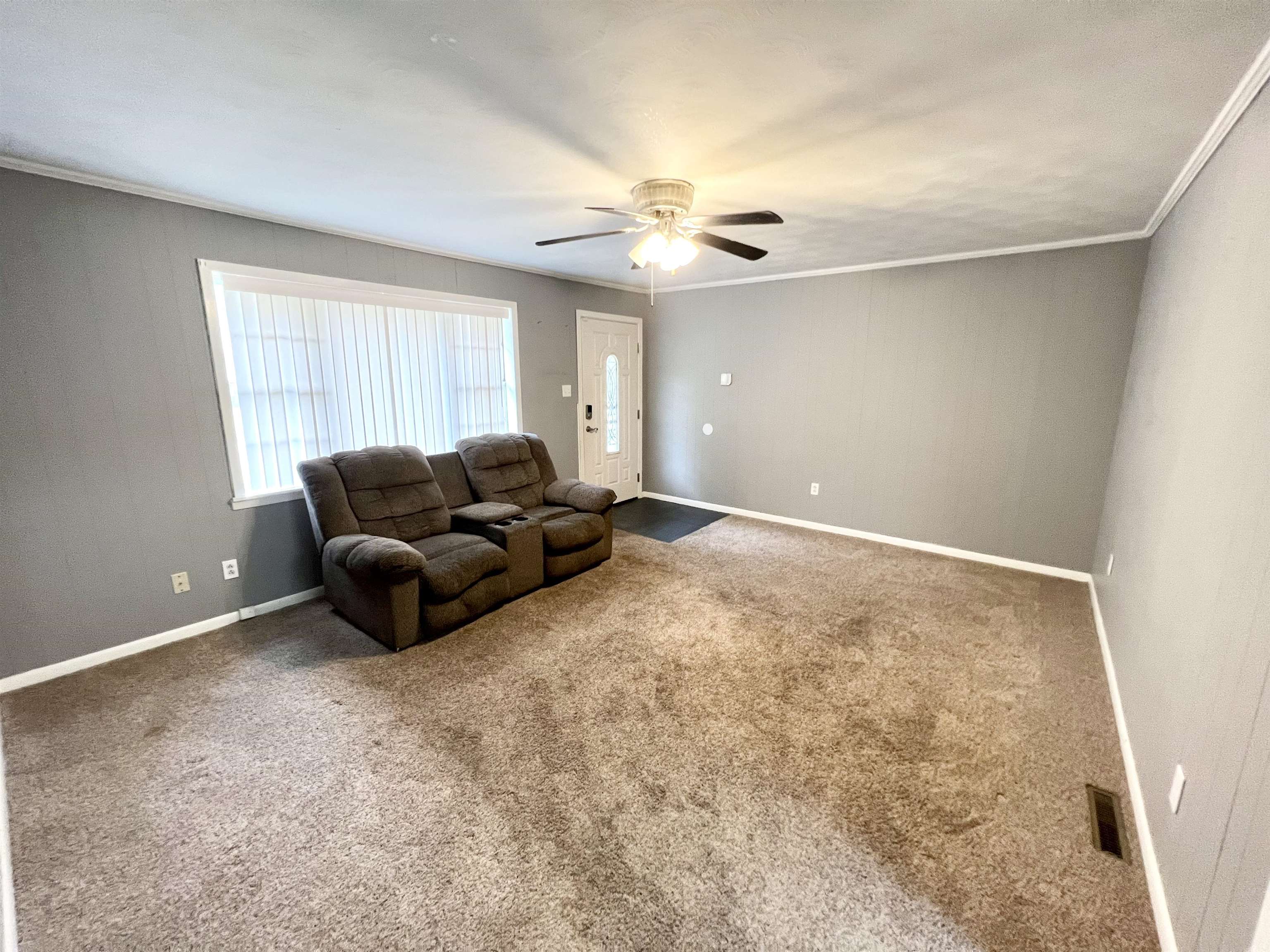 161 Miller Street Ripley, TN 38063 - Photo 2 of 10 a living room with furniture and a ceiling fan