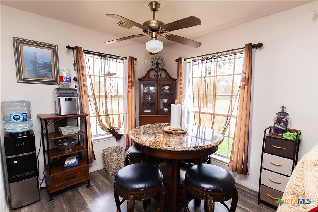 802 Bay Street Austwell, TX 77950 - Photo 8 of 27 a dining room with furniture and window