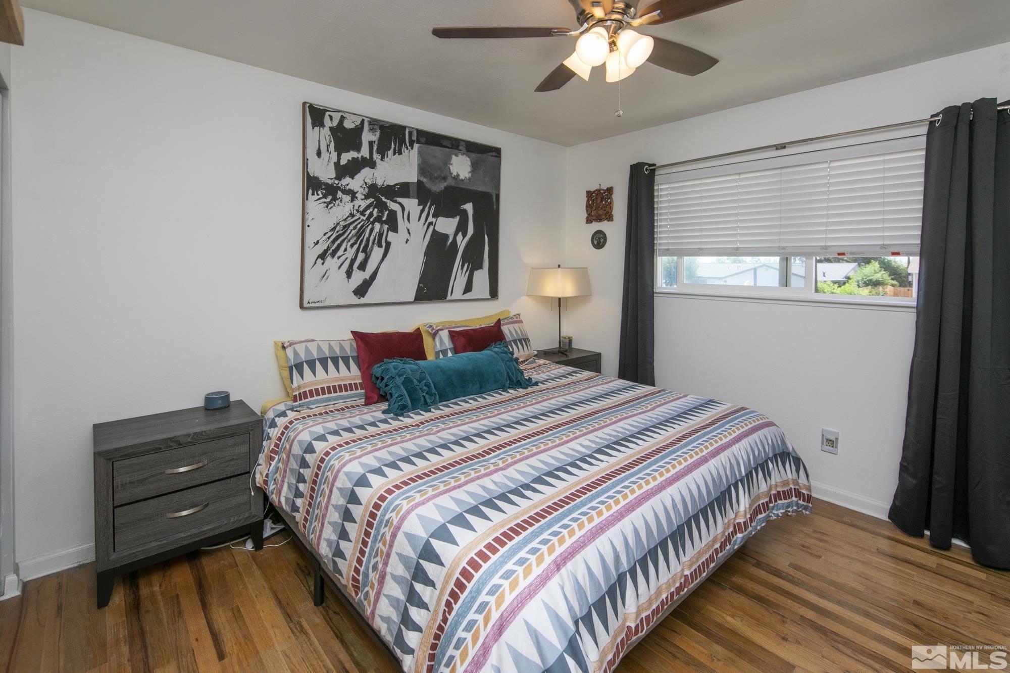 3475 Bryan Street Reno, NV 89503 - Photo 13 of 20 a bedroom with a bed and a chandelier