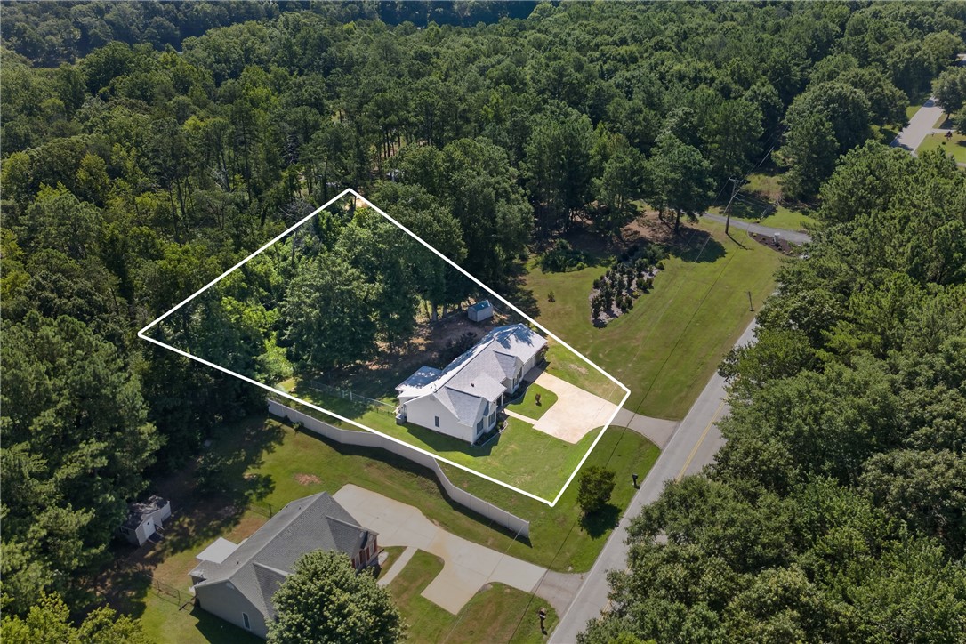 3336 Centerville Road Anderson, SC 29625 - Photo 44 of 50 Perched amidst a verdant landscape, this property offers serene privacy and ample outdoor space.