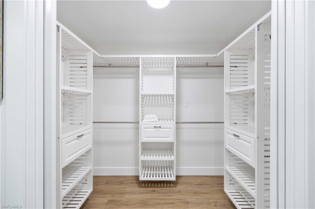 4732 West Boulevard, Unit E5 Naples, FL 34103 - Photo 26 of 40 Walk in closet with light wood-type flooring