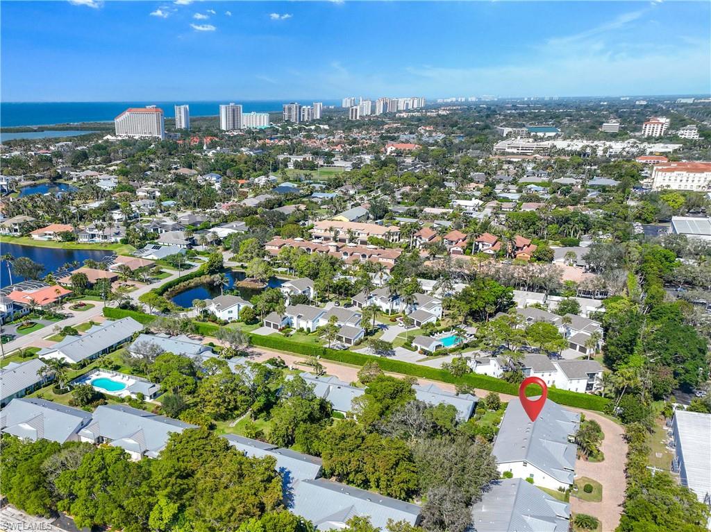 4732 West Boulevard, Unit E5 Naples, FL 34103 - Photo 34 of 40 Birds eye view of property featuring a water view