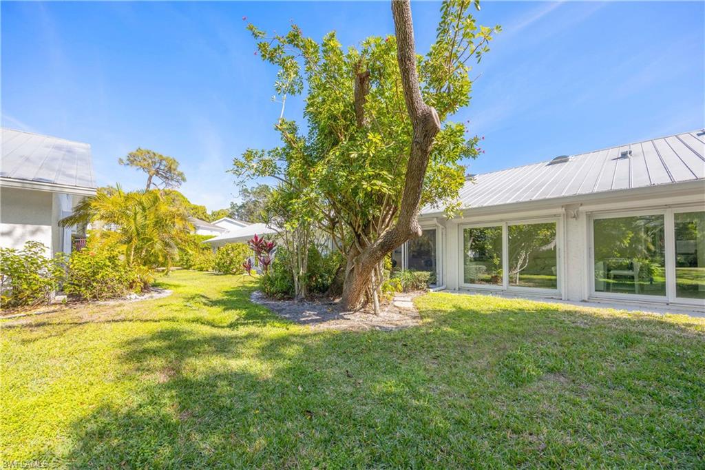 4732 West Boulevard, Unit E5 Naples, FL 34103 - Photo 37 of 40 View of yard