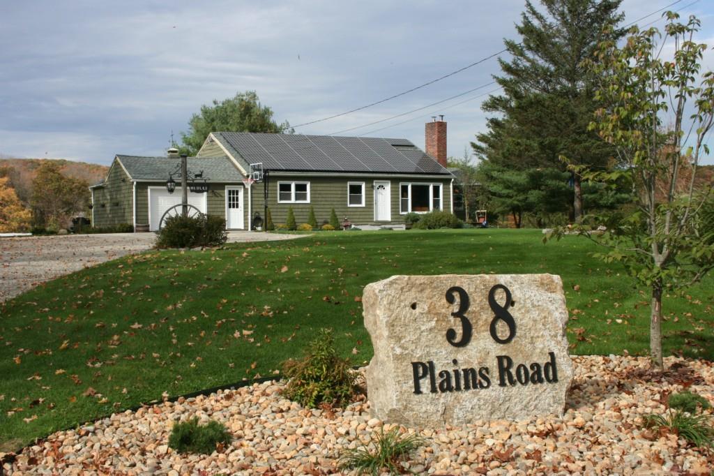38 Plains Road Franklin, CT 06254 - Photo 1 of 1 a front view of a house with garden