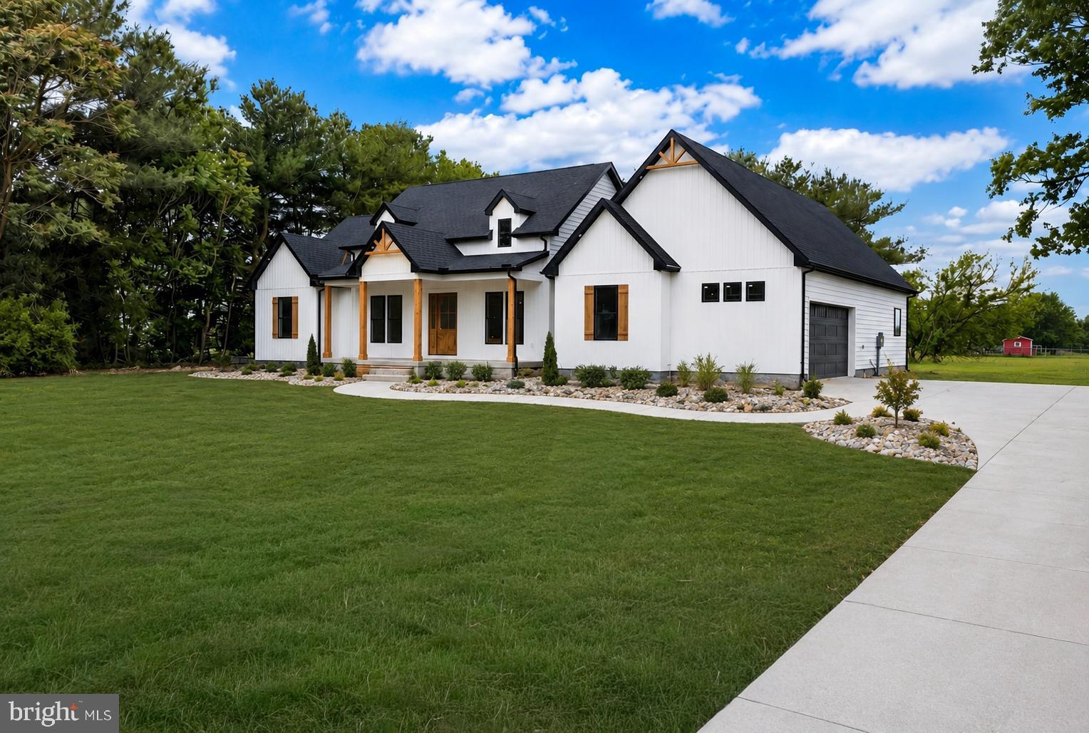 a front view of house with a garden and patio