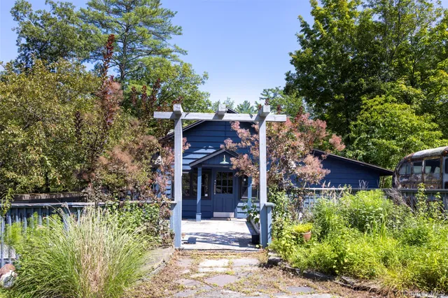 front view of a house with a small yard