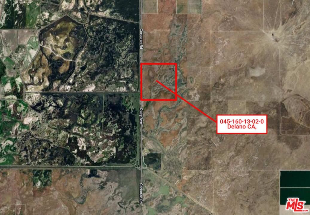 a street sign that is sitting on a brick wall