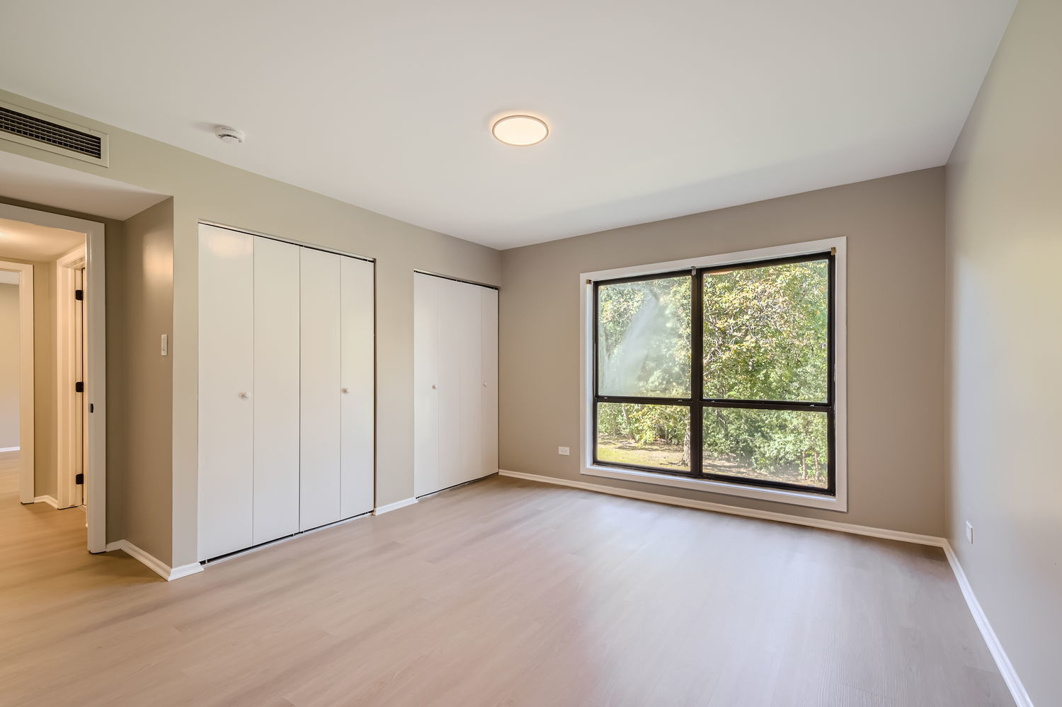 1060 Shermer Road, Unit 26 Northbrook, IL 60062 - Photo 11 of 17 a view of an empty room with a window