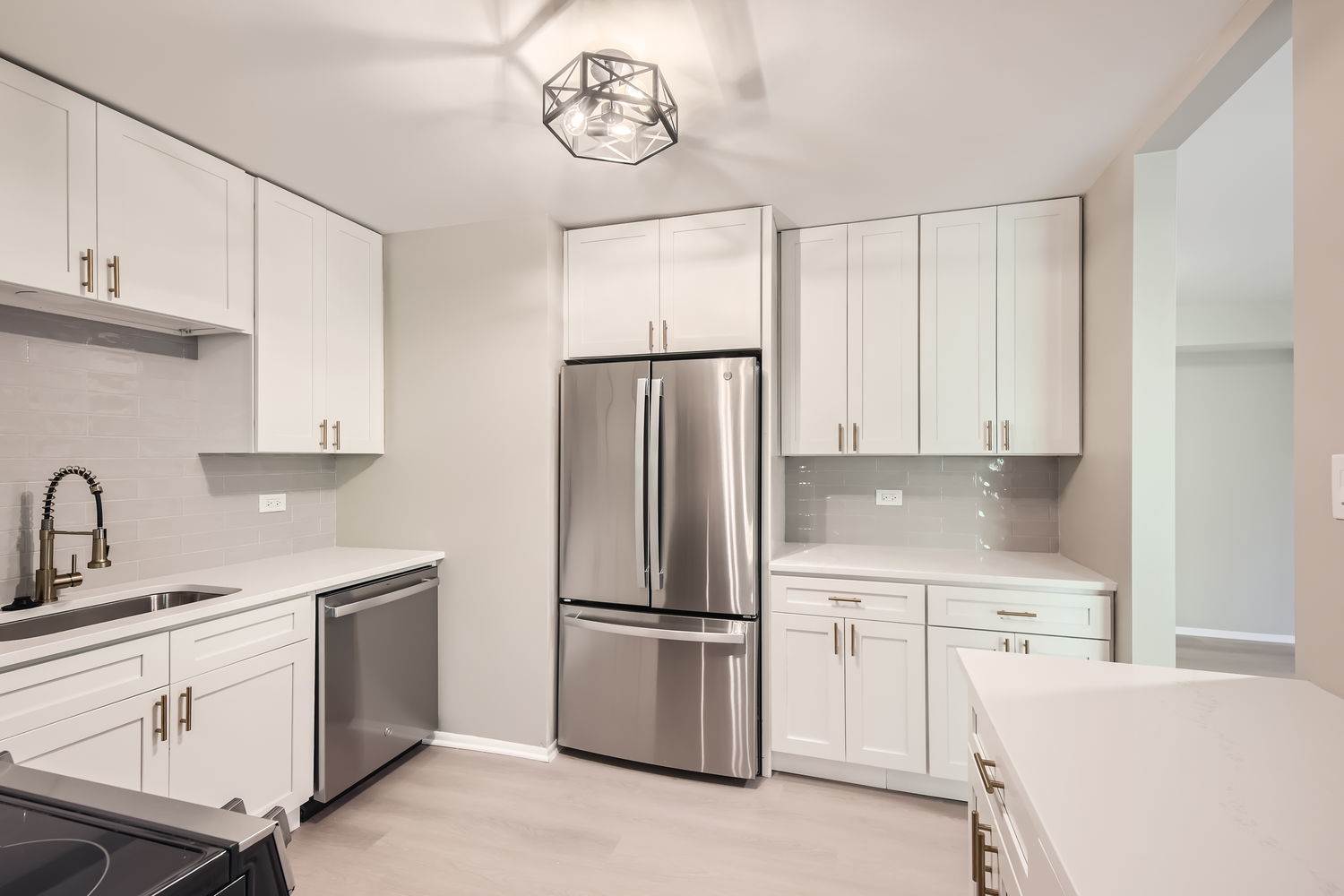 1060 Shermer Road, Unit 26 Northbrook, IL 60062 - Photo 3 of 17 a kitchen with cabinets stainless steel appliances and a counter space