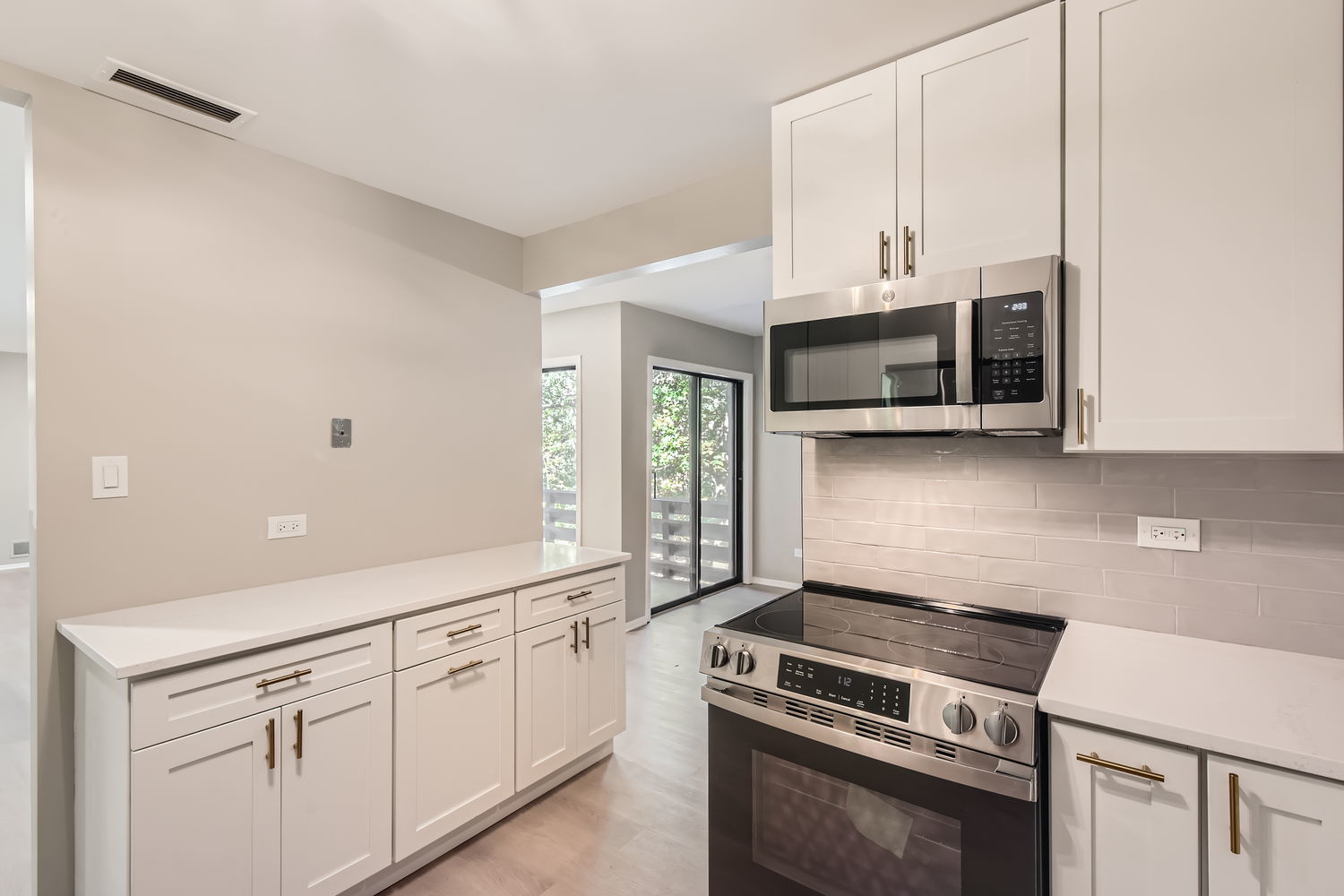 1060 Shermer Road, Unit 26 Northbrook, IL 60062 - Photo 4 of 17 a kitchen with stainless steel appliances white cabinets and a stove