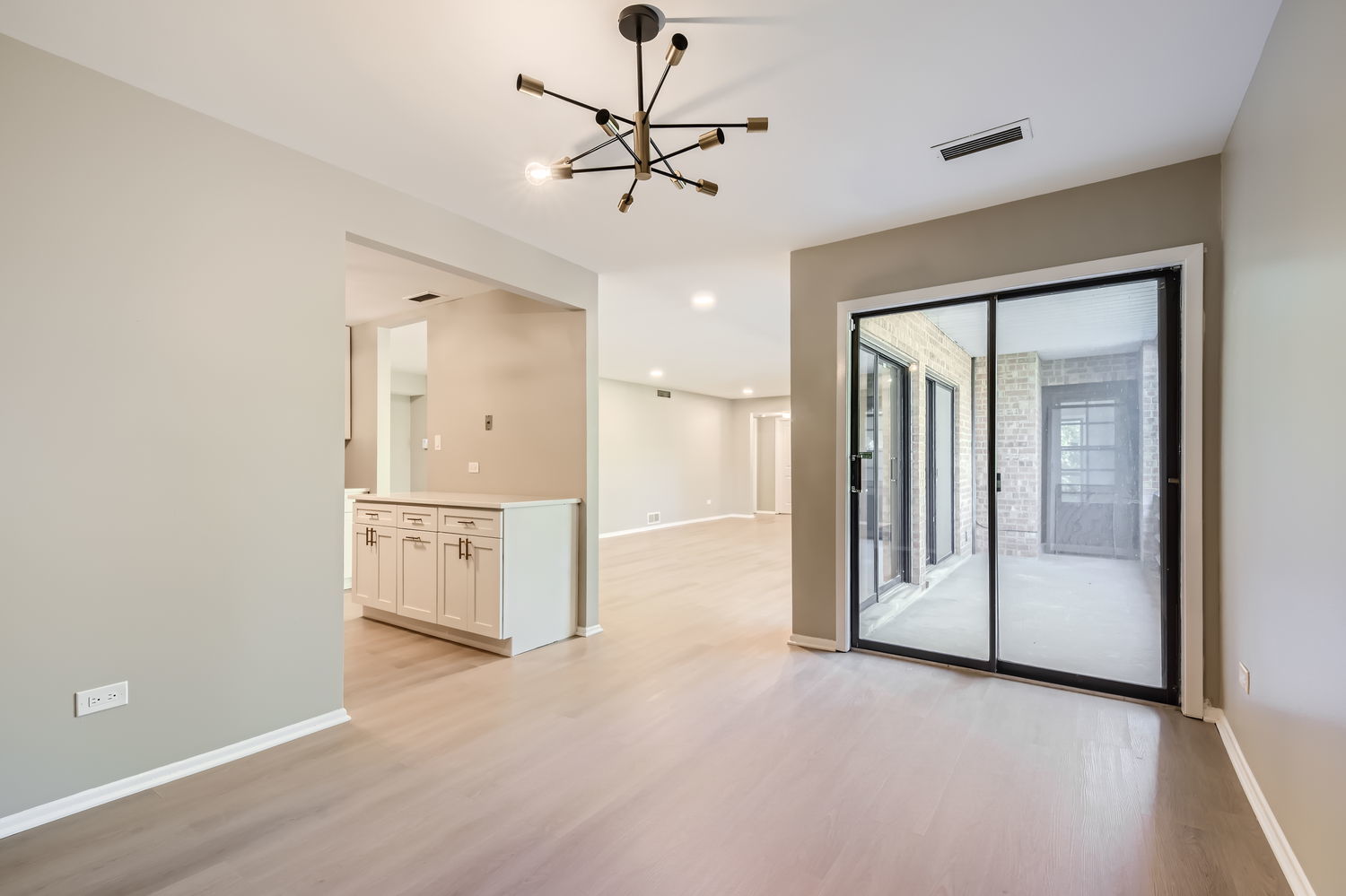 1060 Shermer Road, Unit 26 Northbrook, IL 60062 - Photo 7 of 17 a view of a room with cabinet and a ceiling fan