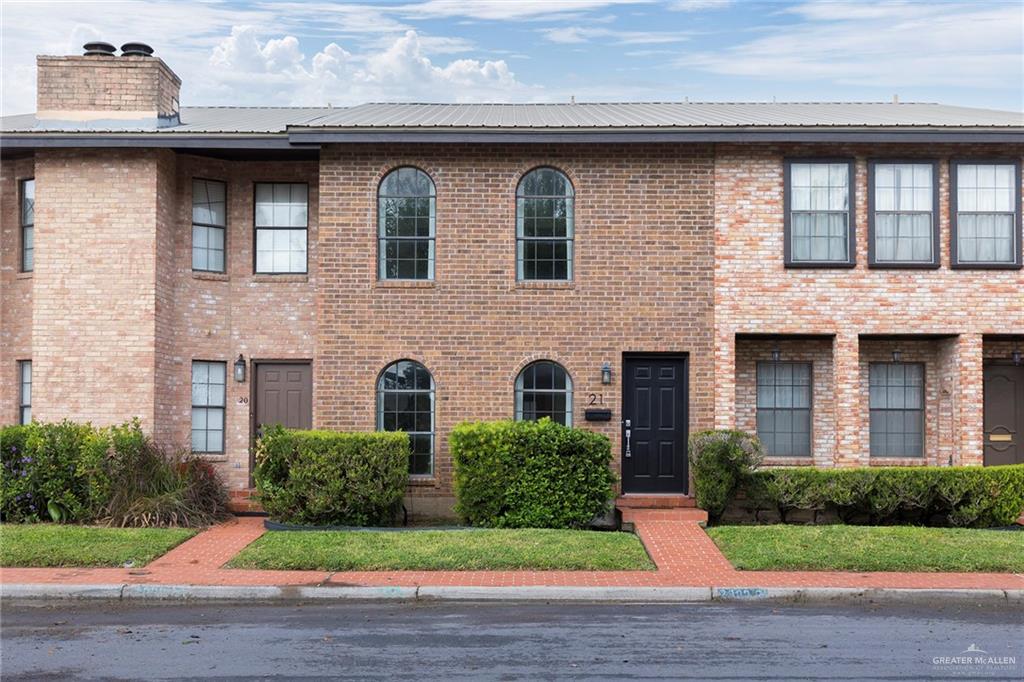 2000 South 5th Street, Unit 21 McAllen, TX 78503 - Photo 1 of 1 a brick building with a yard in front of it