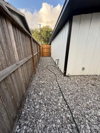 a view of balcony with wooden floor