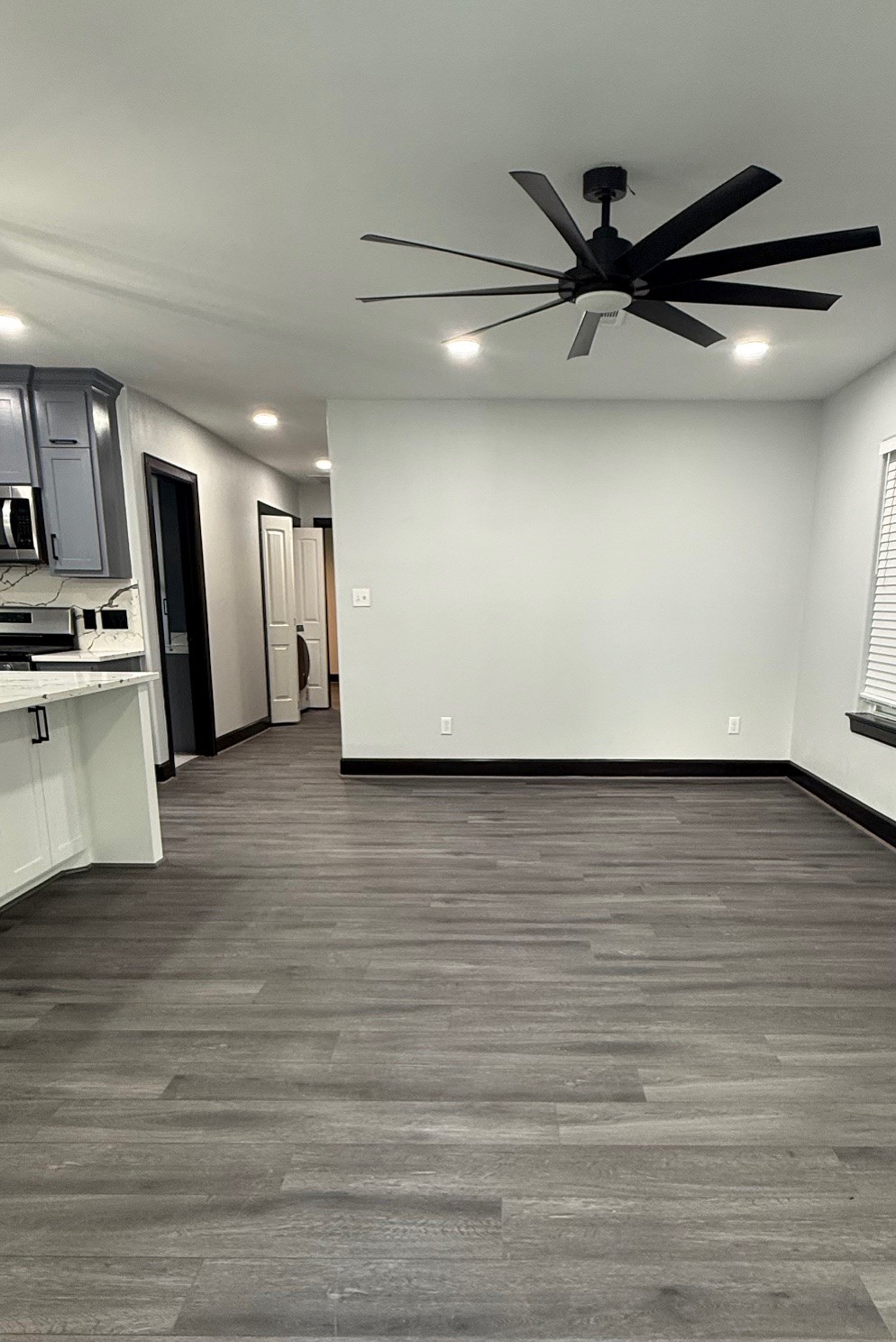 14213 4th Street Santa Fe, TX 77517 - Photo 3 of 20 a view of a kitchen with a sink and a refrigerator