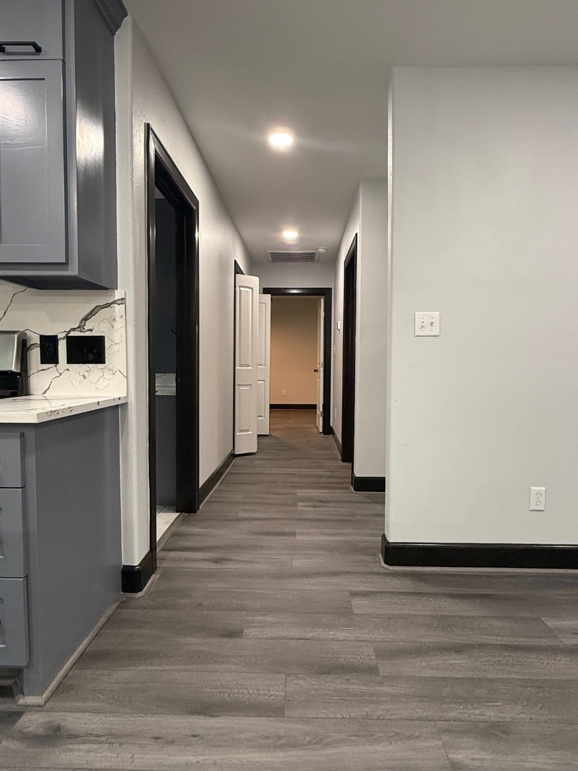14213 4th Street Santa Fe, TX 77517 - Photo 8 of 20 a view of a hallway with wooden floor