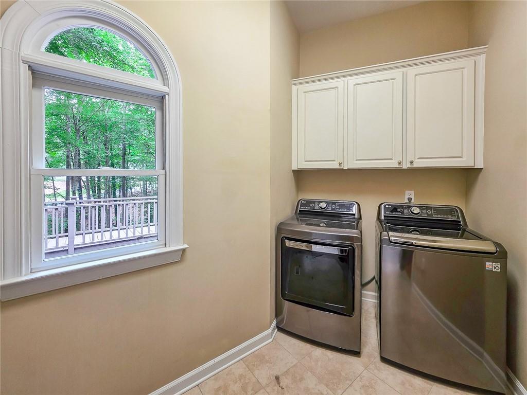 3712 Frederica Road Northwest Berkeley Lake, GA 30096 - Photo 20 of 49 a view of a kitchen with washer and dryer