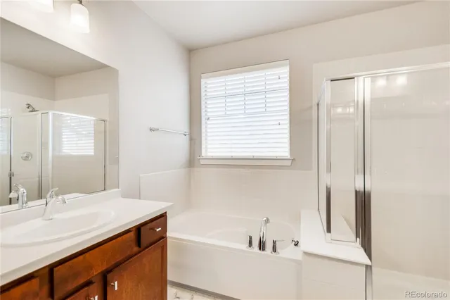 a bathroom with a bathtub and a sink