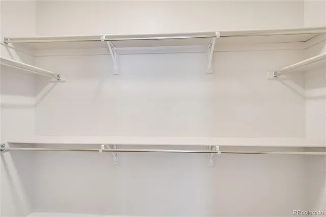 a view of an empty walk in closet