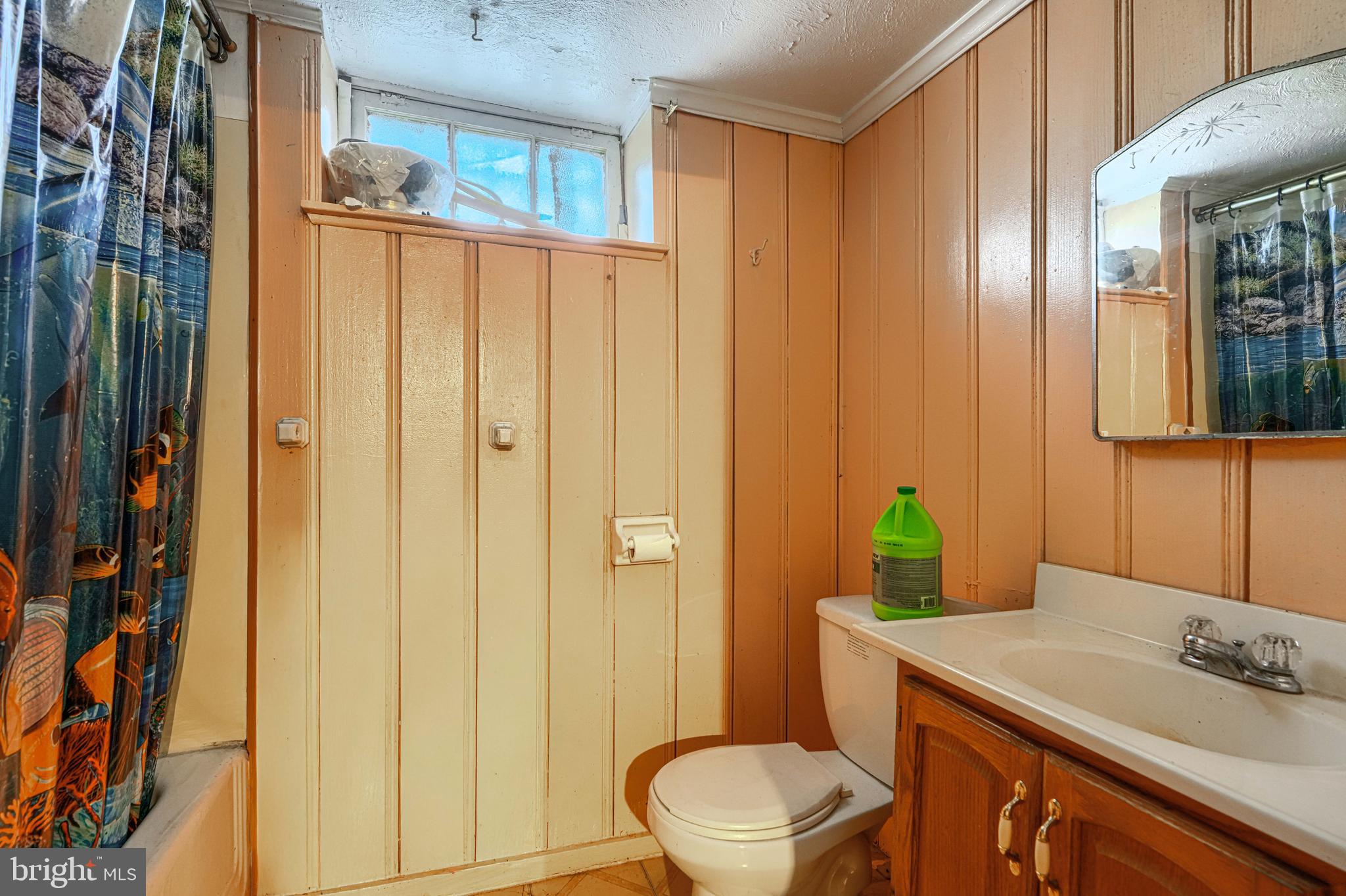 3212 Dorchester Road Baltimore, MD 21215 - Photo 42 of 45 a bathroom with a sink a toilet and shower