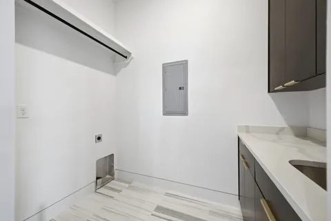 a view of a hallway with a kitchen