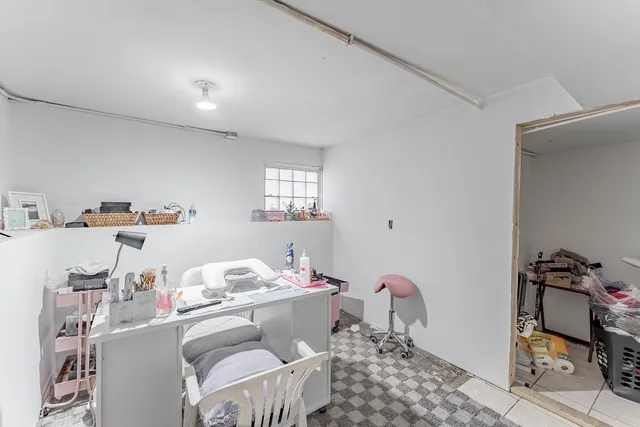 a bedroom with furniture and a window