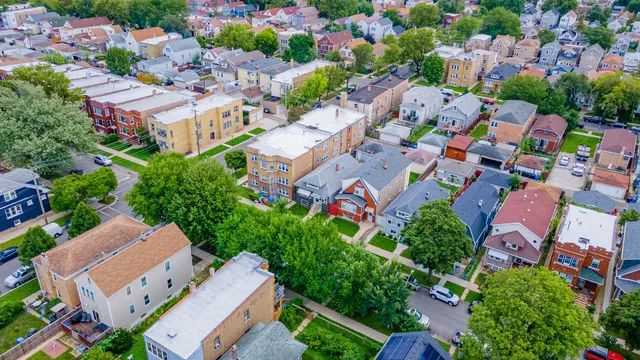 an aerial view of residential houses with outdoor space
