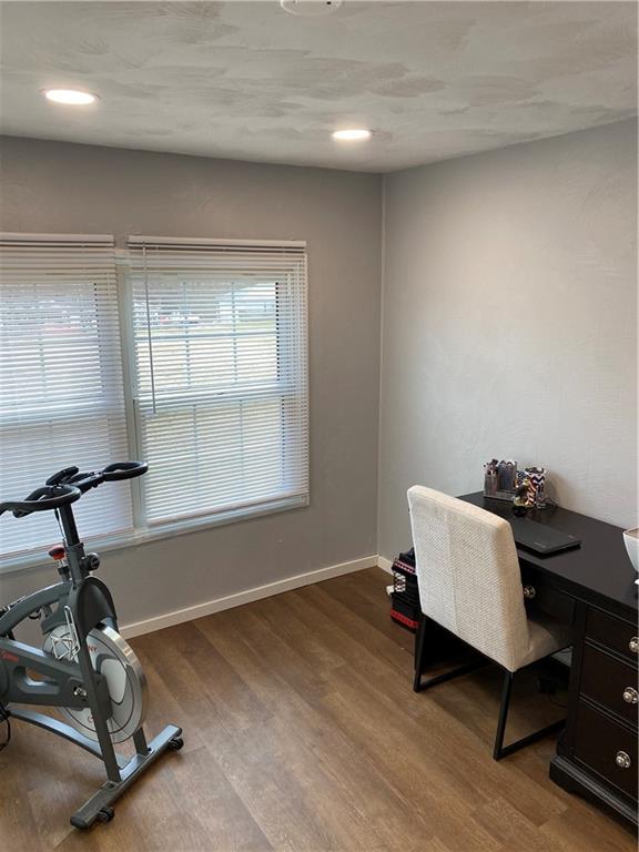 683 10 Mile Road Amity, PA 15311 - Photo 13 of 16 a room with gym equipment on wooden floor and a window