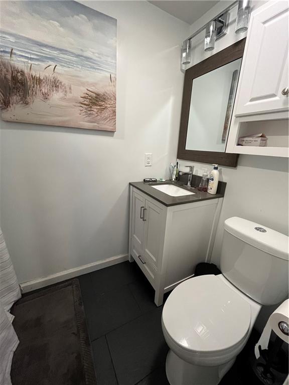 683 10 Mile Road Amity, PA 15311 - Photo 16 of 16 a bathroom with a toilet a sink and mirror
