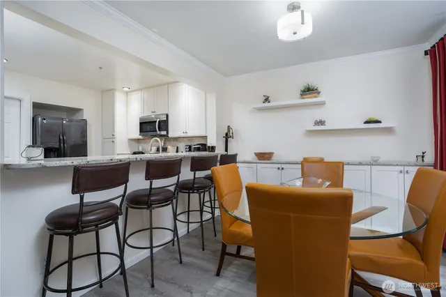 a dining room with furniture and window