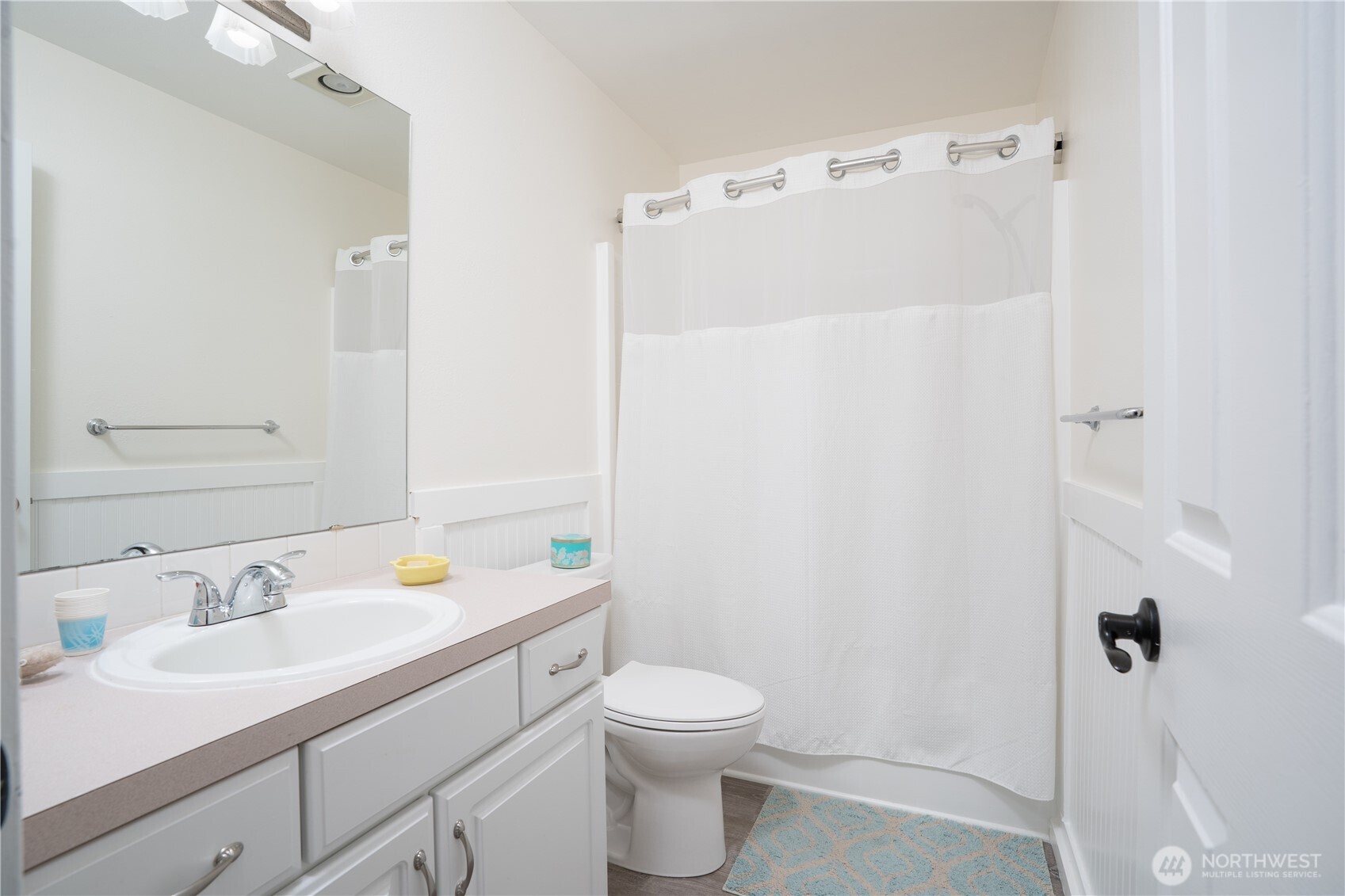 1971 South 368th Place, Unit 902 Federal Way, WA 98003 - Photo 17 of 39 a bathroom with a sink a toilet and shower