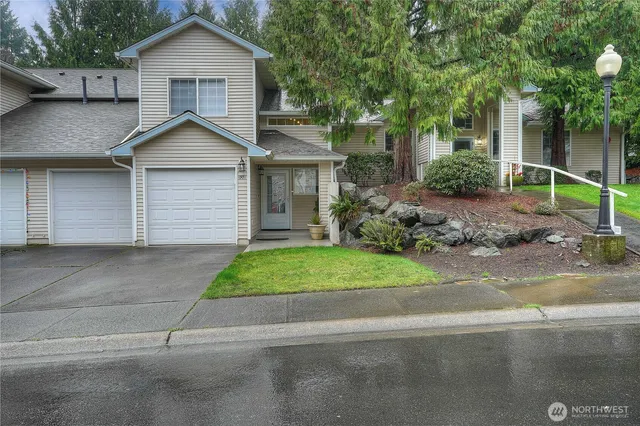 a view of a yard in front view of a house