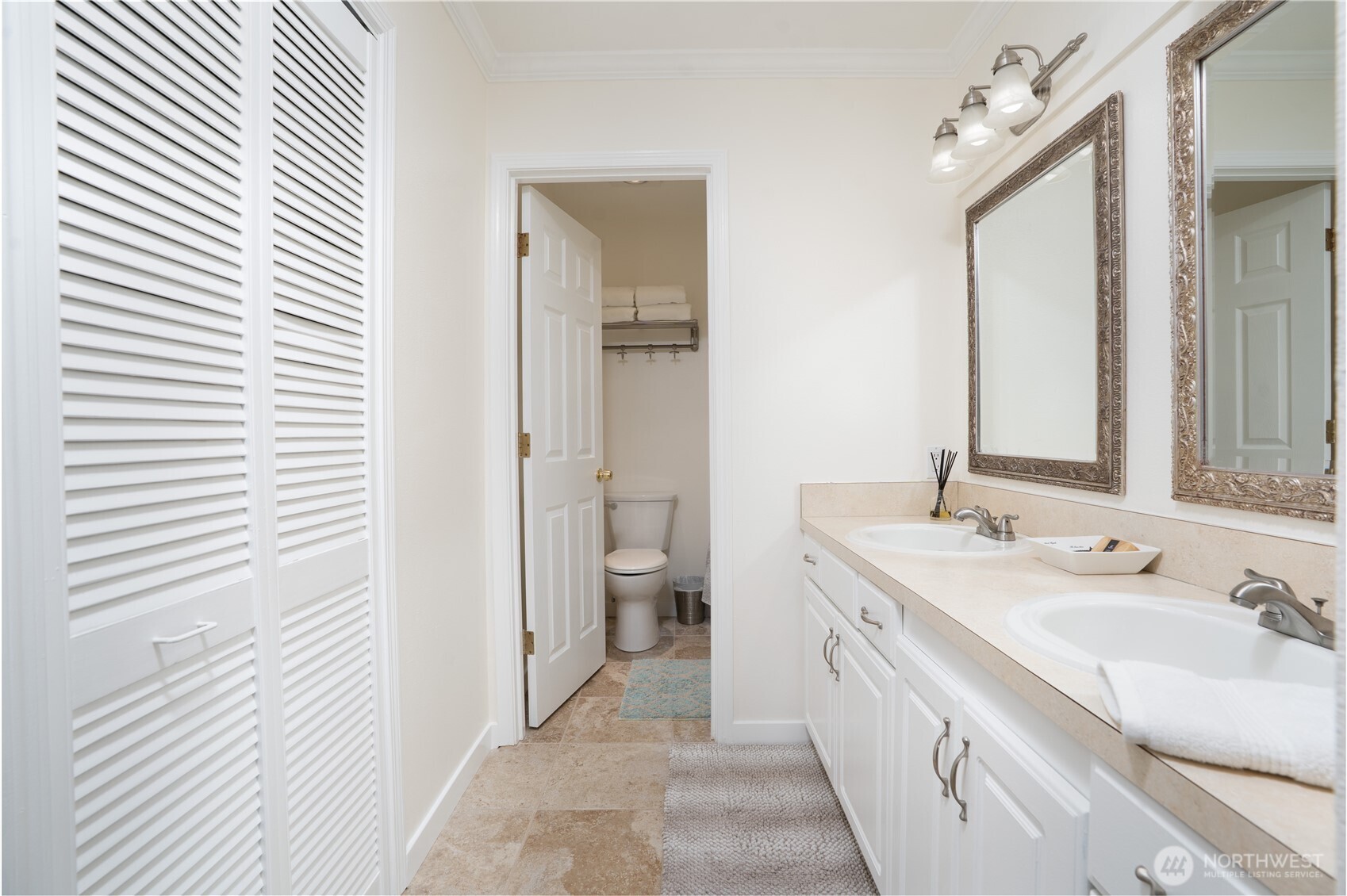 1971 South 368th Place, Unit 902 Federal Way, WA 98003 - Photo 21 of 39 a spacious bathroom with a double vanity sink and a mirror