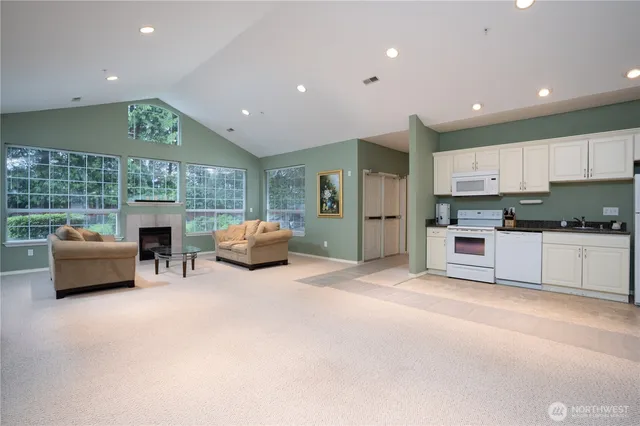 a kitchen with furniture and a fireplace