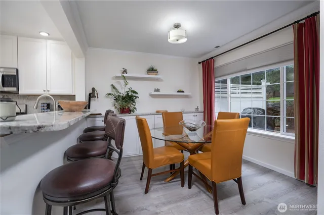 a view of a dining room with furniture window and outside view