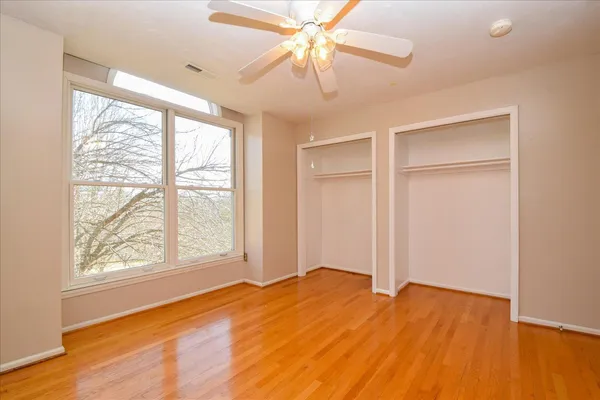 a view of a room with wooden floor